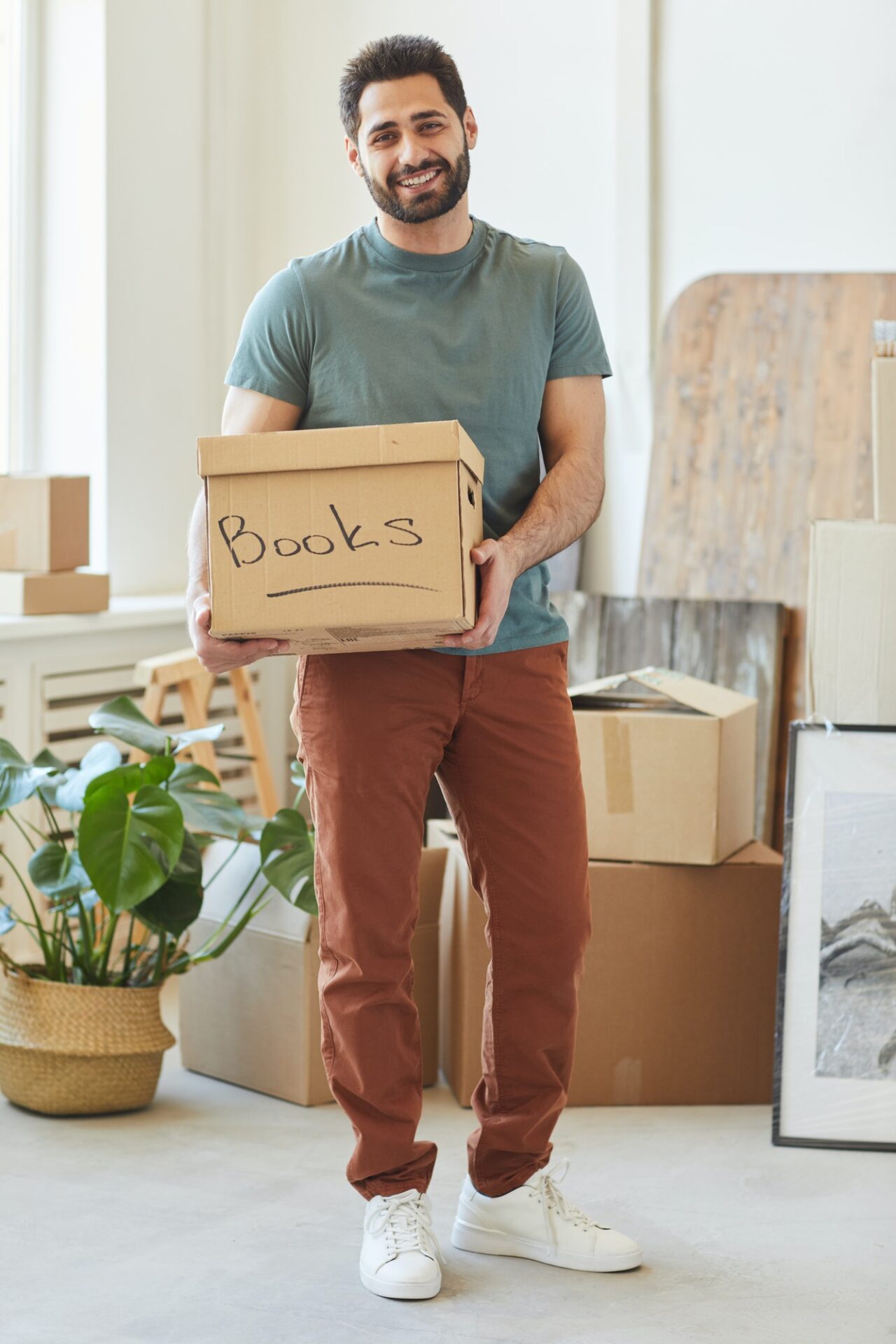 bearded guy moving in new house