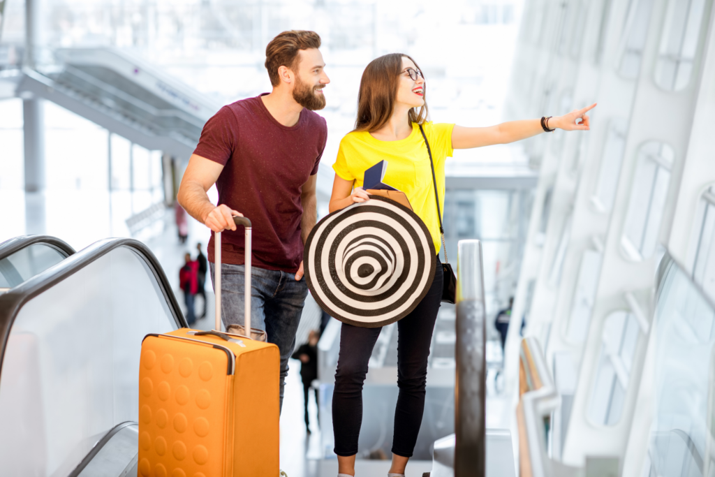 Young couple with luggage at an airport